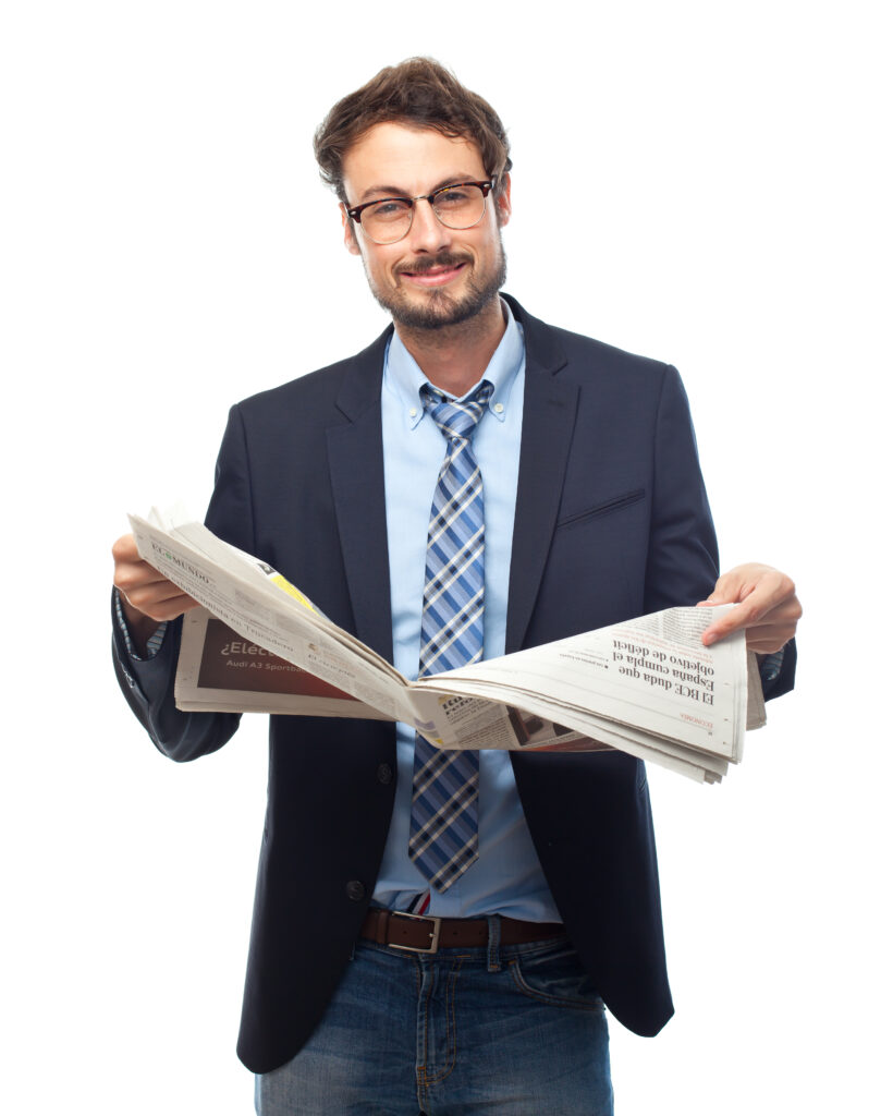 CONTÁCTANOS young crazy businessman confident with a newspaper